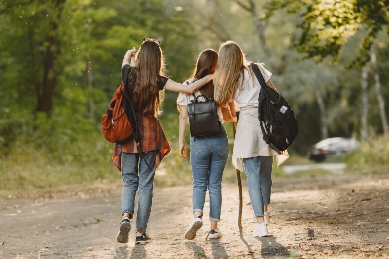 teenagers walk in nature