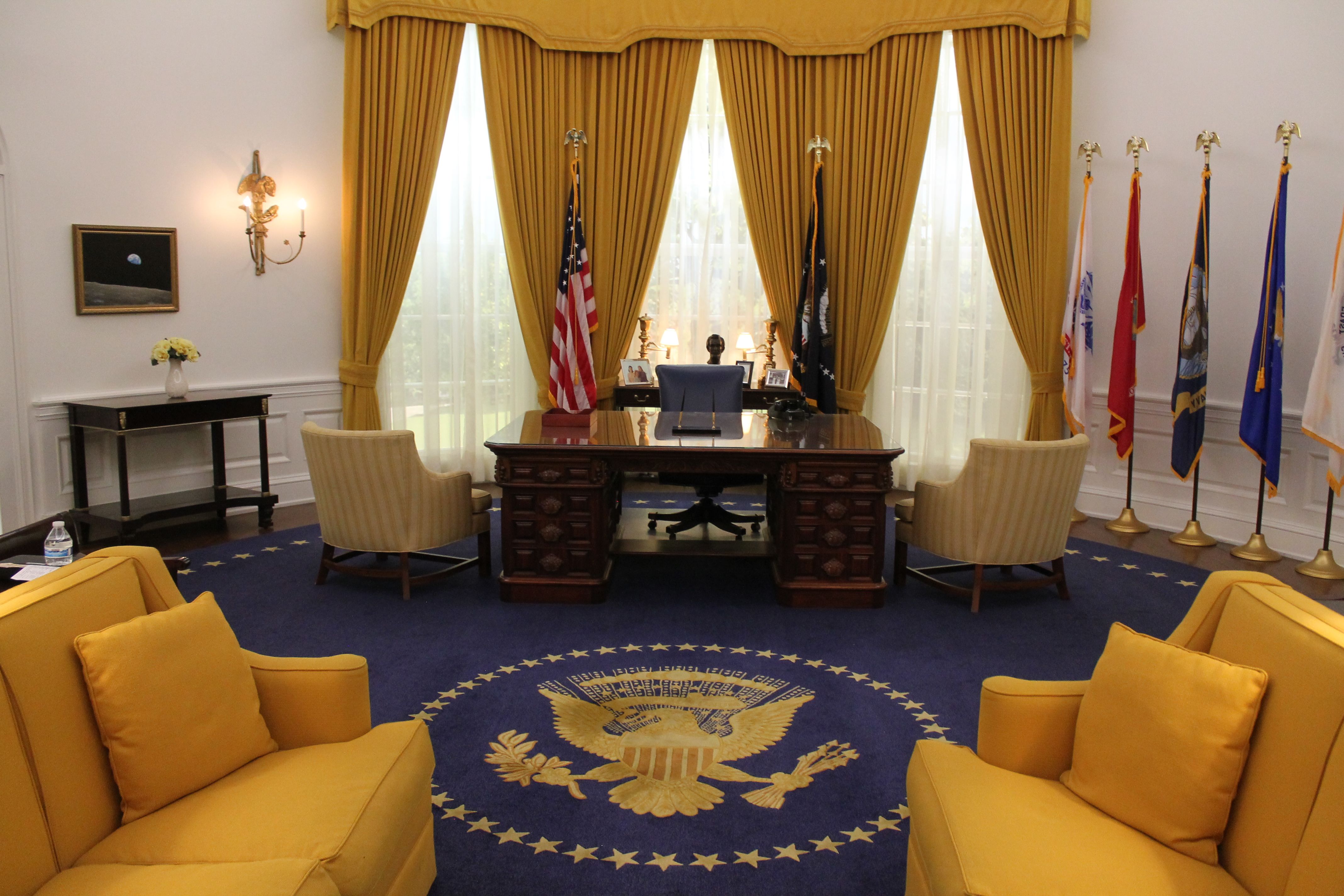 Elegant presidential office interior with flags and imposing furniture, representing political power