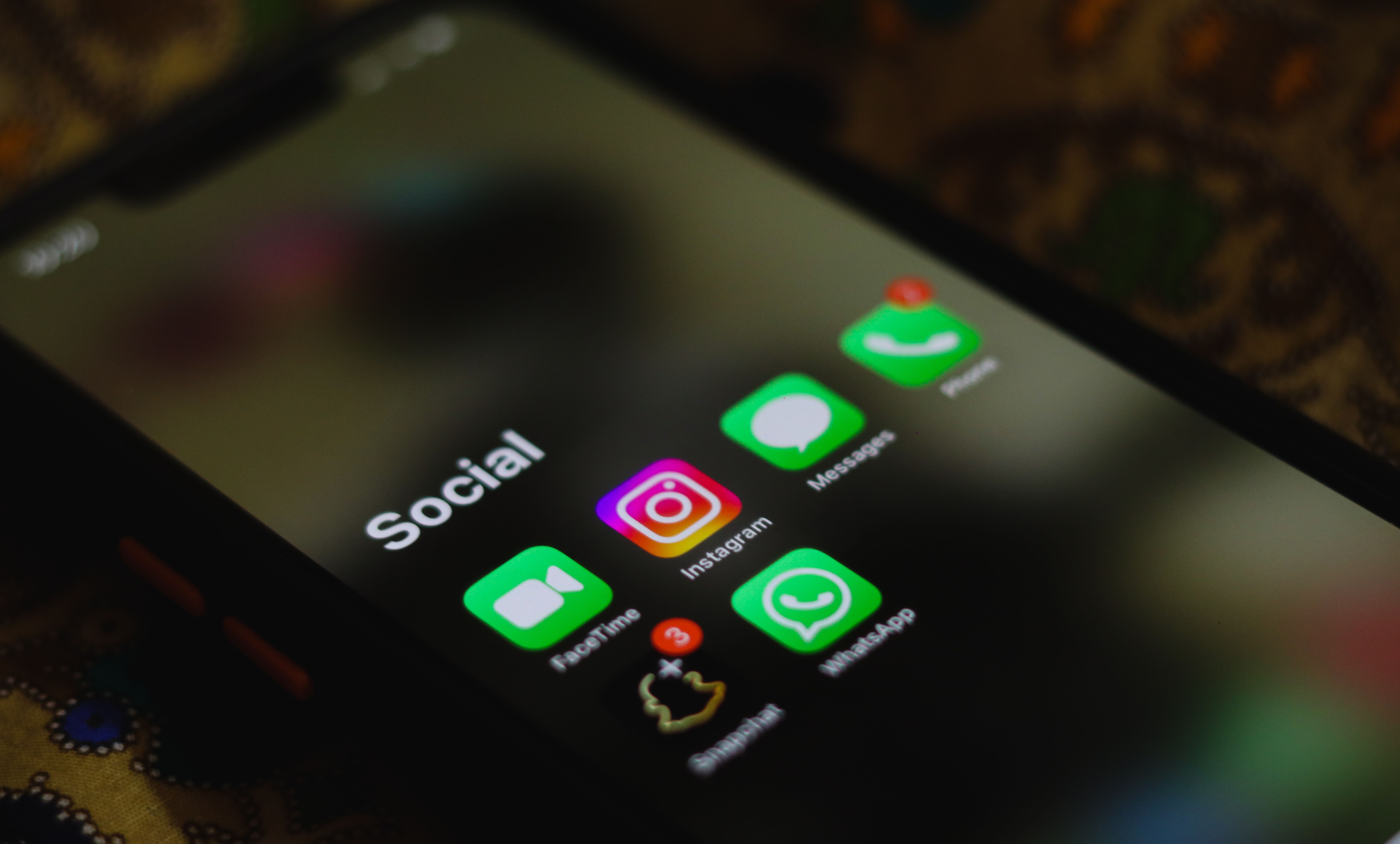 Close-up of a smartphone displaying social media app icons